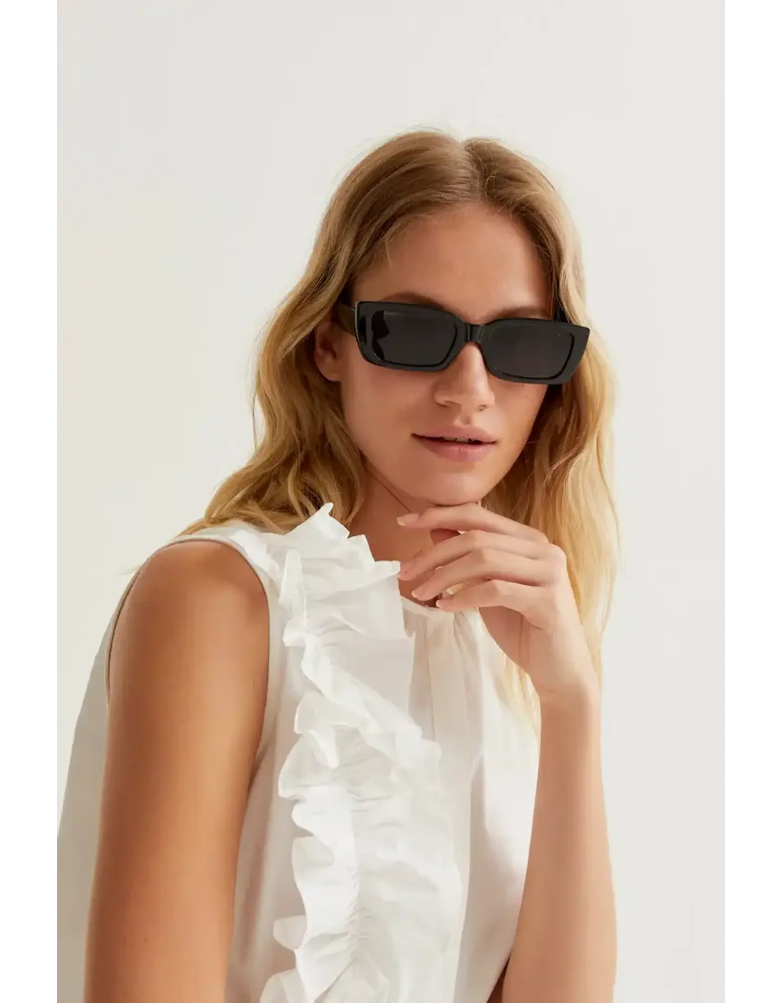 SLEEVELESS BLOUSE WITH RUFFEL DETAIL