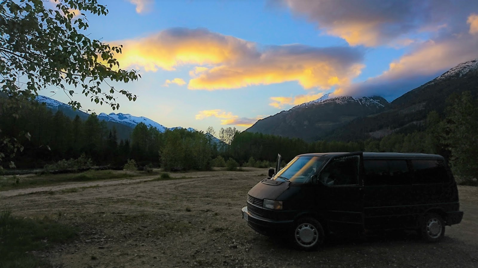 Eurovan parked in the moutains at sunset