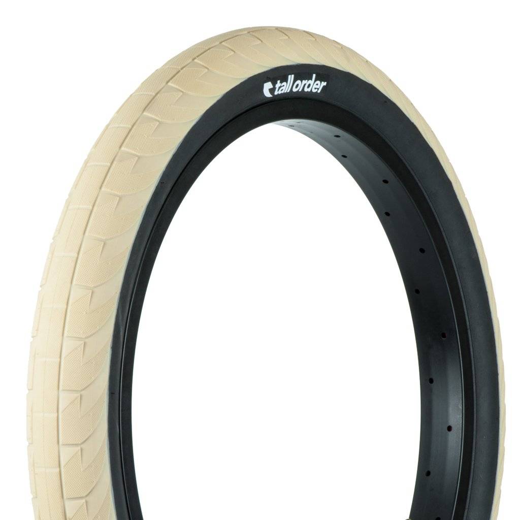 Tall order wall ride tire 20x2.30 tan with black wall.