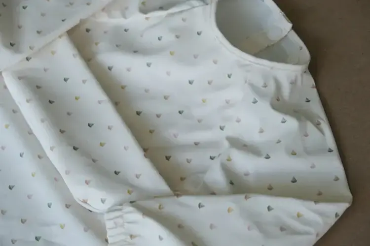 Micasso & Co Micasso & Co  Long-sleeved bib with integrated pocket