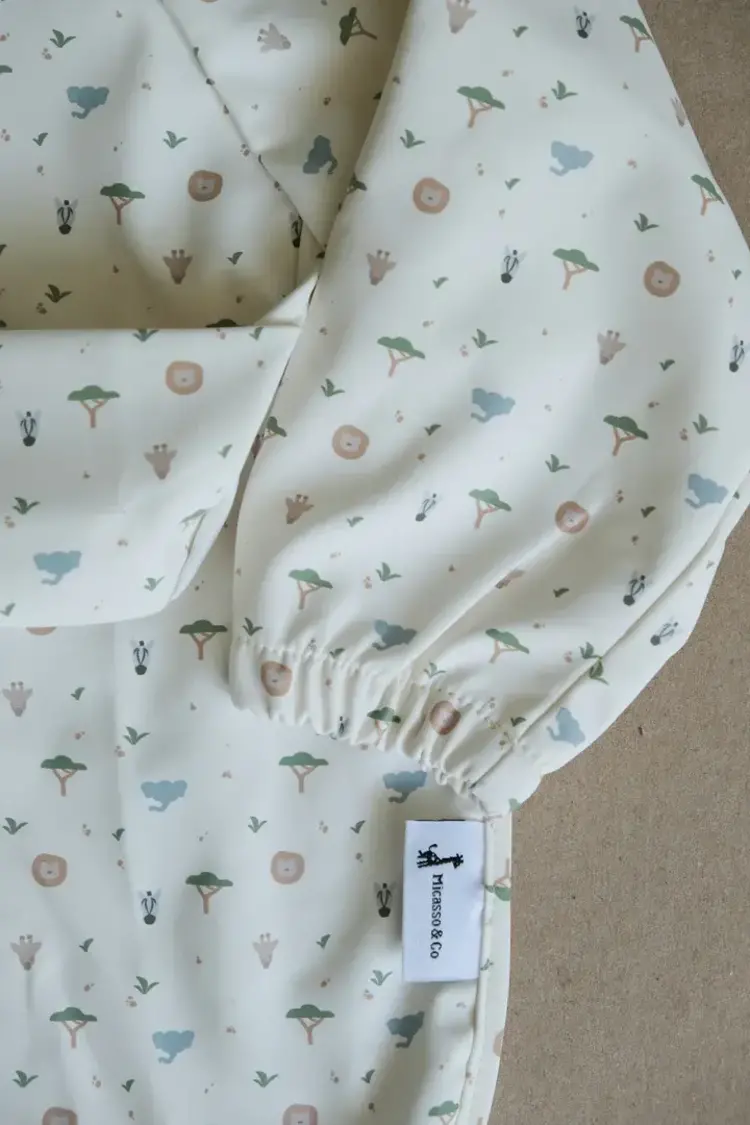 Micasso & Co Micasso & Co  Long-sleeved bib with integrated pocket