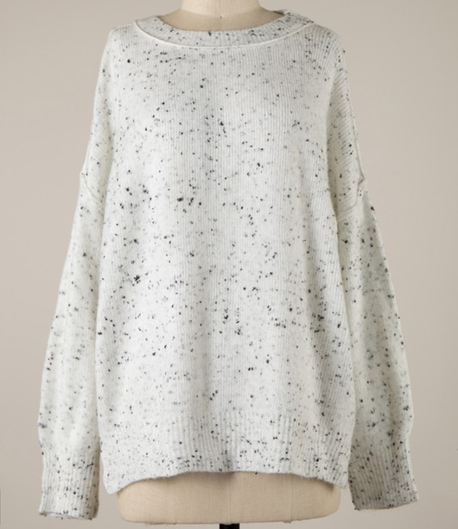 White speckled shop sweater