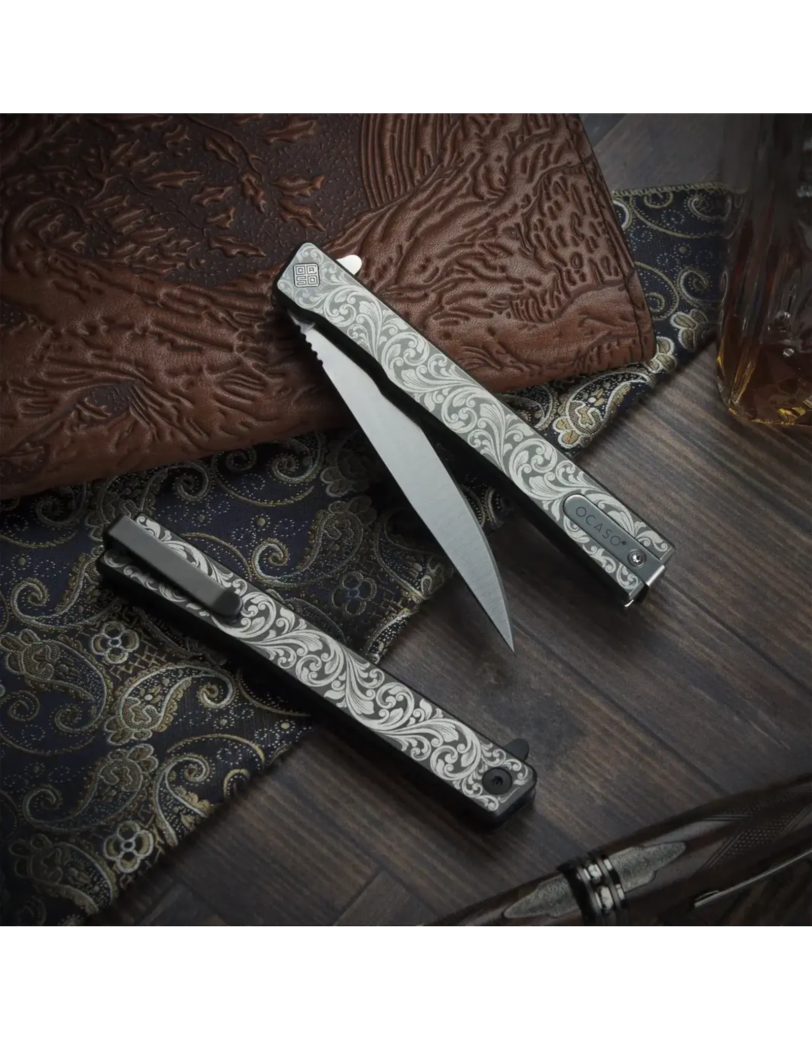 Ocaso Ocaso Knives Demko 10ESS Solstice Executive Liner Lock Flipper Knife 3.5" S35VN Satin Drop Point Blade, "Scroll" Engraved Gray Titanium Handles