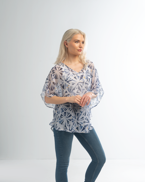 Simply Noelle Abstract Circle Curved Hemline Top By: Simply Noelle