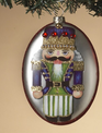 Glass Oval Nutcracker Ornament (3-Styles) Glass Oval Nutcracker Ornament (3-Styles)