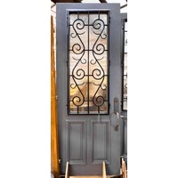 Iron Scrollwork Door with Reeded Glass