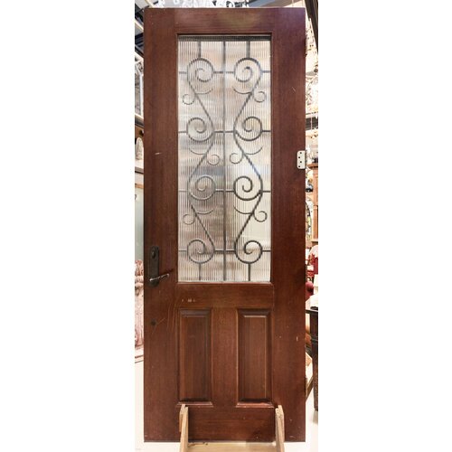 Iron Scrollwork Door with Reeded Glass