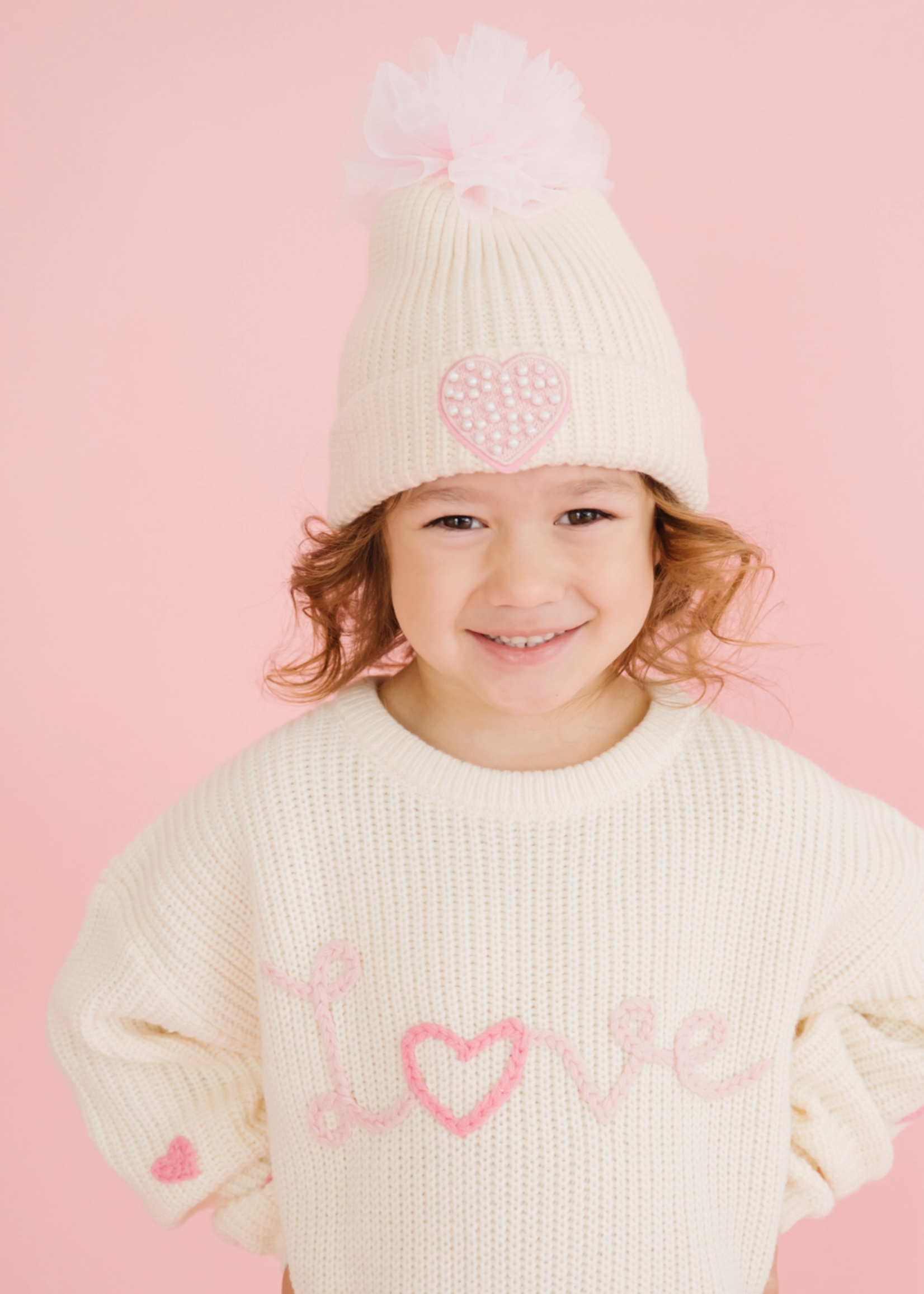 Sweet Wink Pearl Heart Patch Pom Pom Beanie