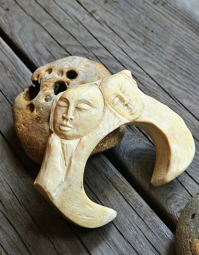 Large Carved Antler Faces and Eagle Cuff