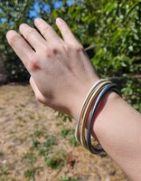 Tapered Oval Bangle with Thick Ends  in Golden Bronze