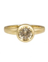 Raised Cup Solitaire with Pale Yellow / White  Brilliant Cut Sapphire in 18k Yellow Gold
