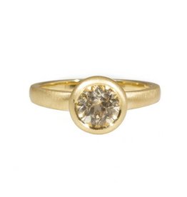 Raised Cup Solitaire with Pale Yellow / White  Brilliant Cut Sapphire in 18k Yellow Gold