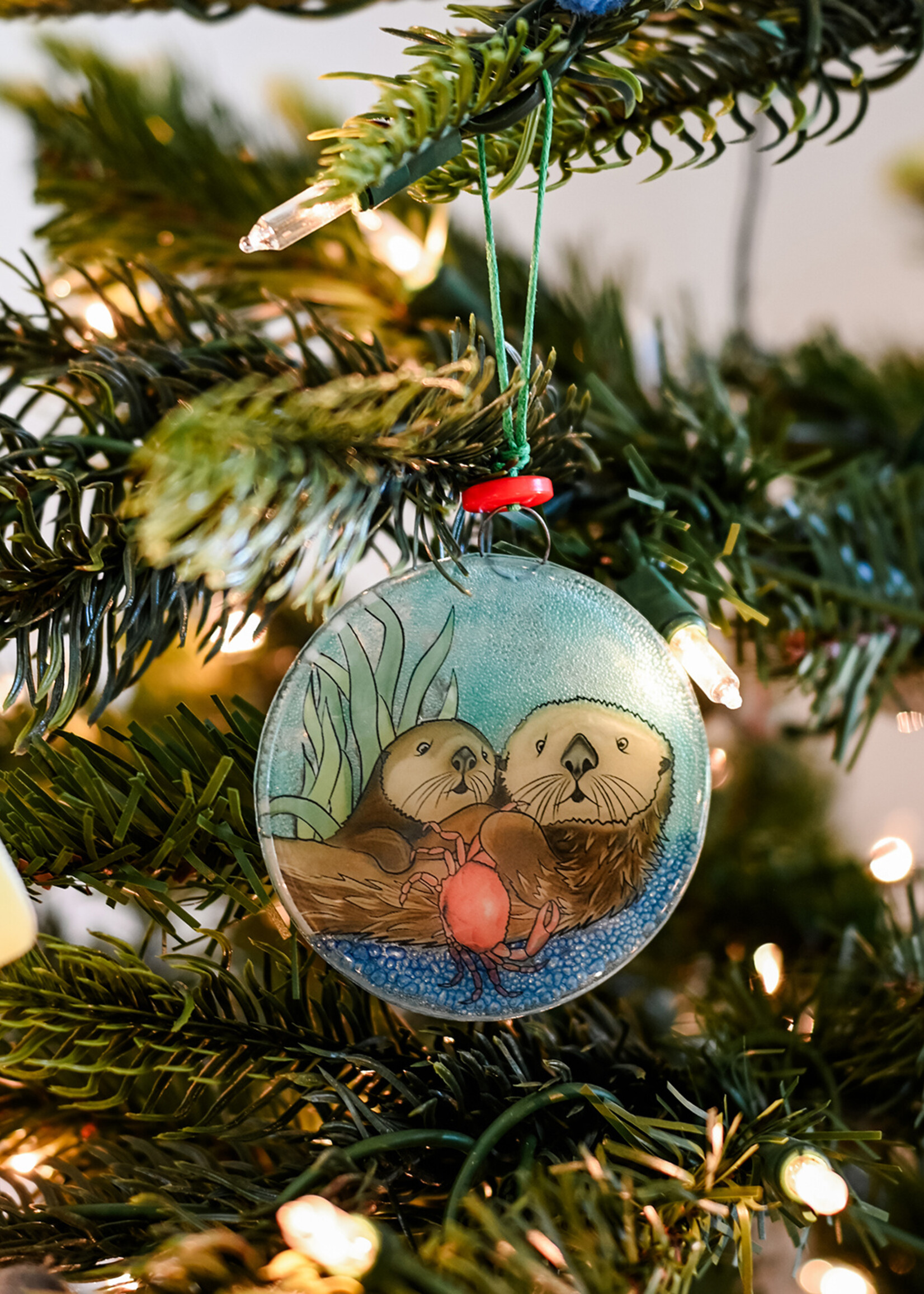 Pampeana Otter with Crab Glass Ornament