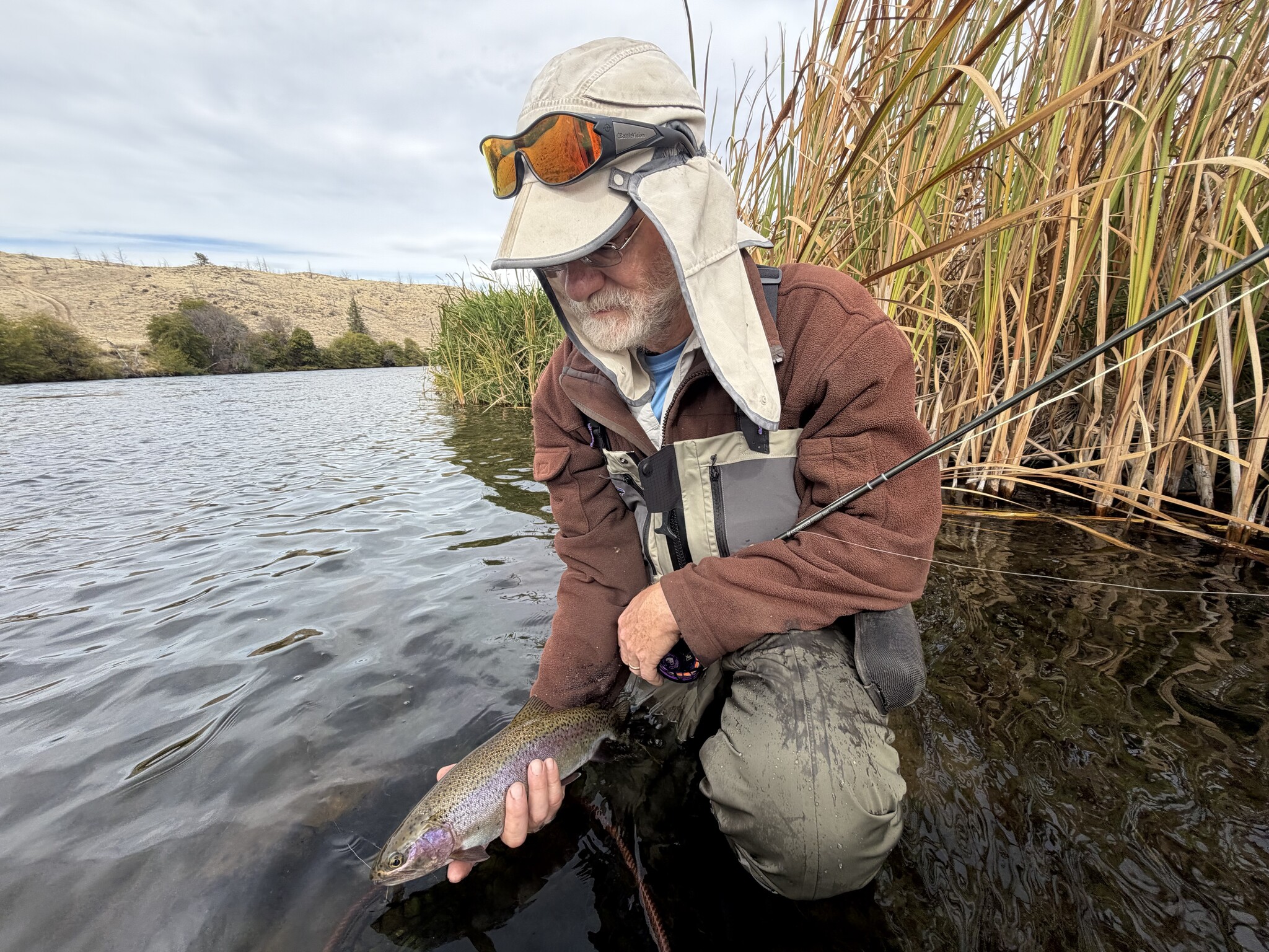 One of Josh's clients from his recent guide trip about to release a Deschutes redside.