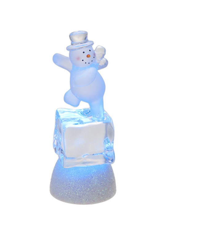 Bonhomme de neige sur cube de glace illuminé