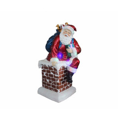 Père-Noël dans une cheminée avec lumières