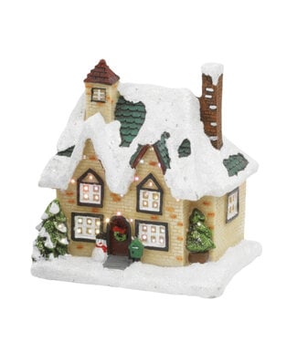 Maison crème avec bonhomme de neige LED