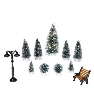Ensemble sapins, luminaire et banc de parc
