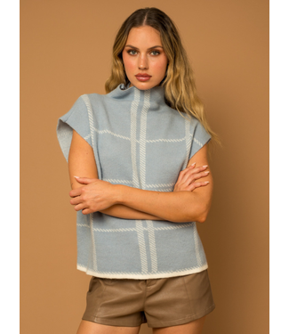 THE SIENNA SWEATER is a modern twist on a Scandinavian, motive-patterned  sweater with an unexpected scallop hem. The relaxed body is m