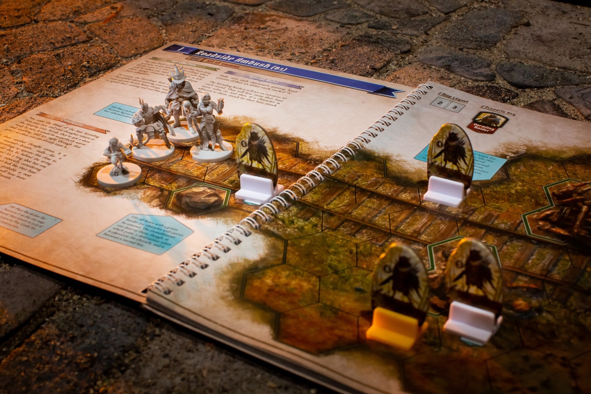 Jaws of the Lion features a fantastic spiral-bound book that includes the story and setup of each scenario, as well as the map! Set up is a breeze!