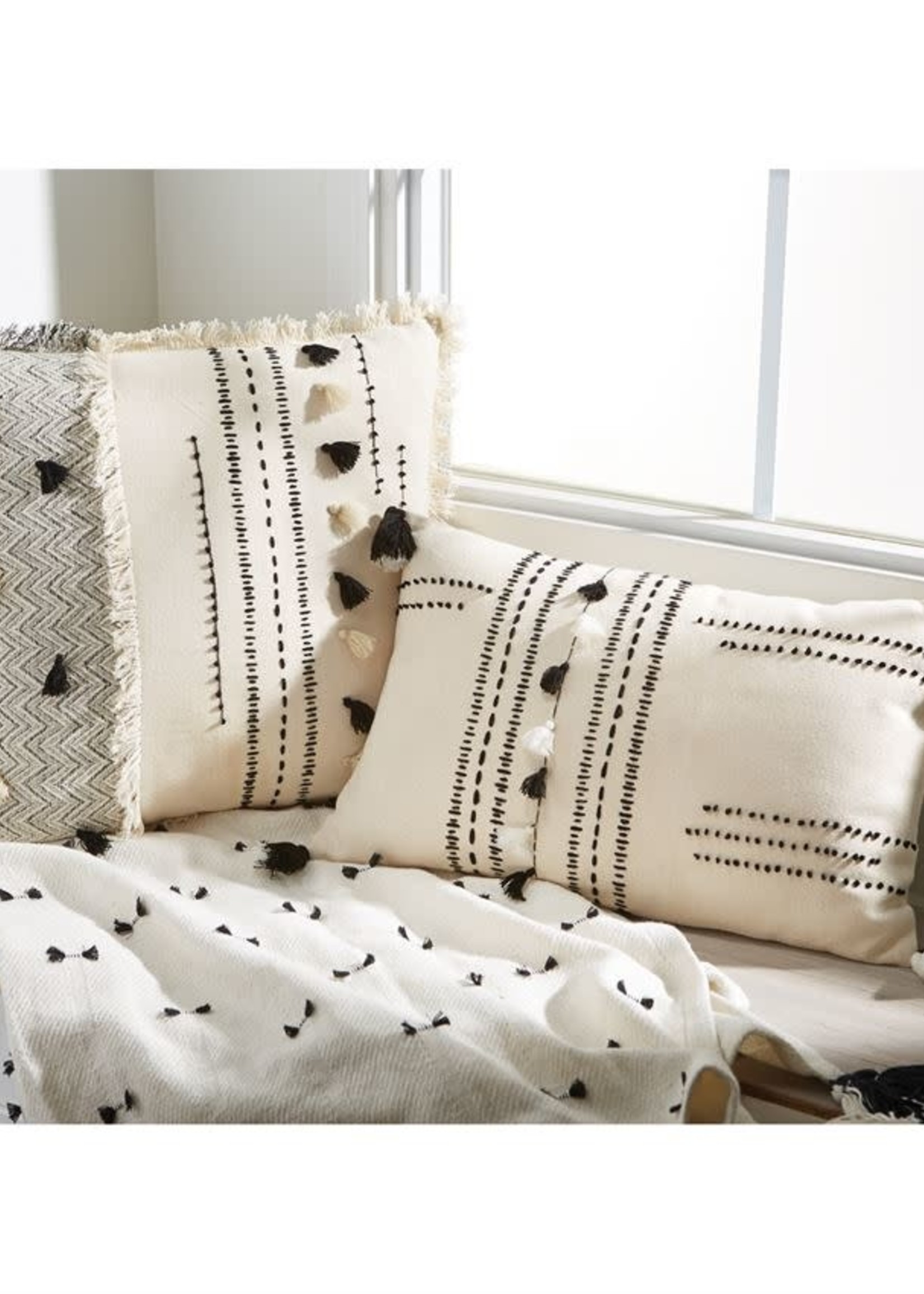 white tassel pillow