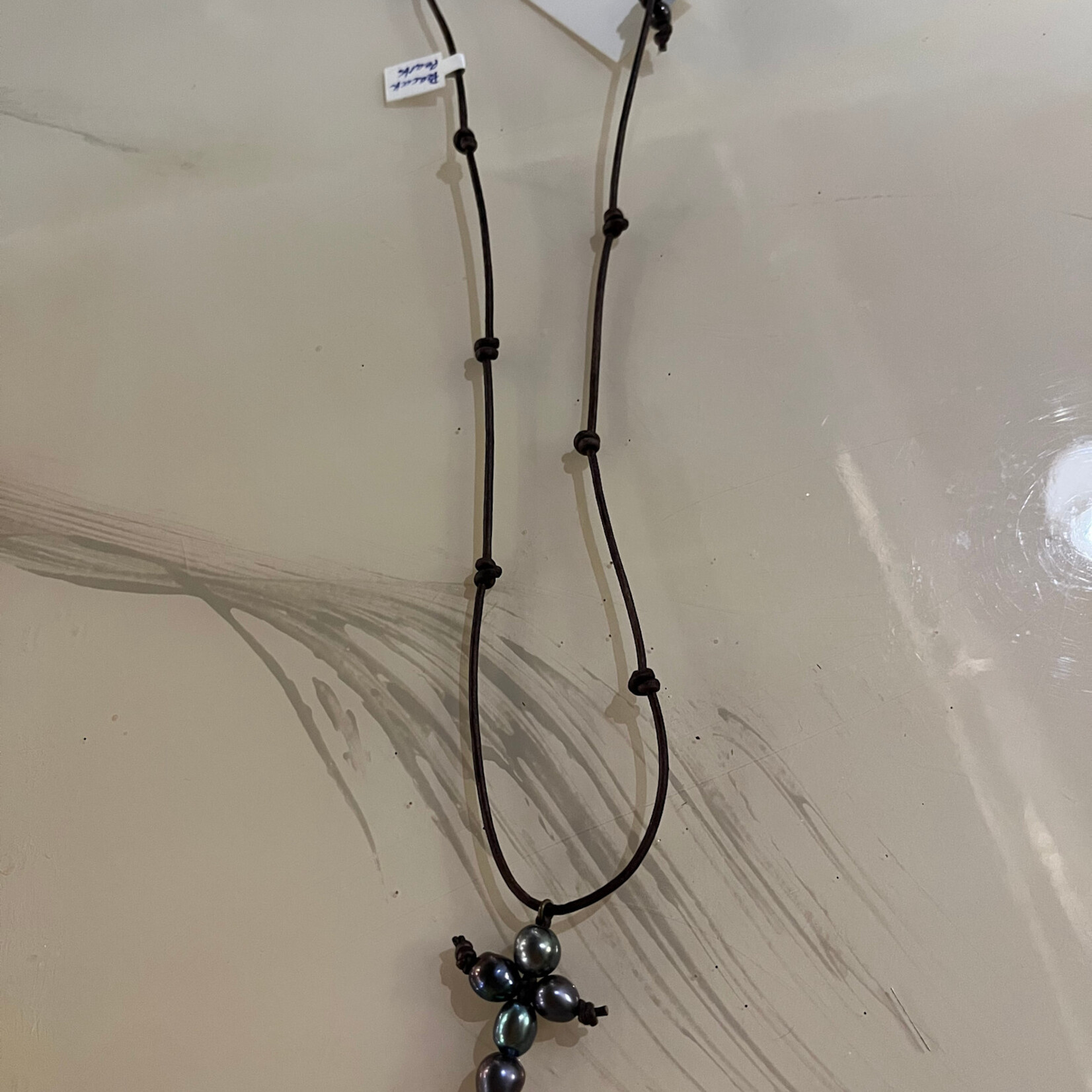 Coastal Courture Peacock Pearl Cross on Knotted Leather/ Coconut Button