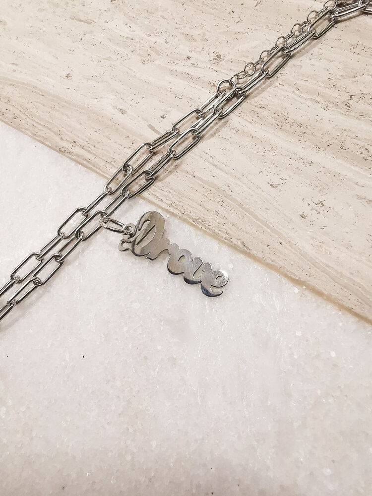 "Drove" Script Charm Rhodium