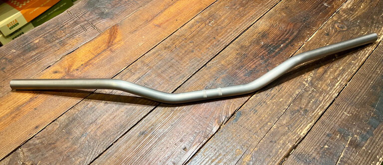 Doom Bars Doom Bars: Titanium Lucky Riser, 2" Rise, 14° Sweep, Raw finish