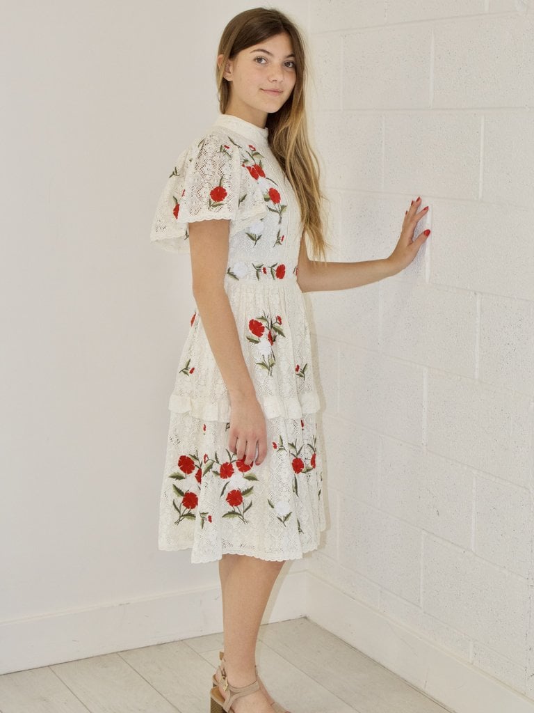 cream dress with red flowers