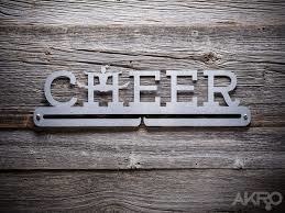 Medals Stand AKRO,, "Cheer"