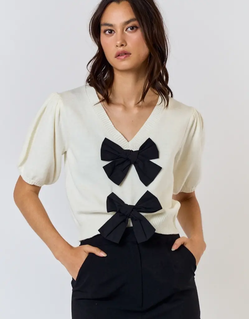Ivory Sweater Top With Black Bows