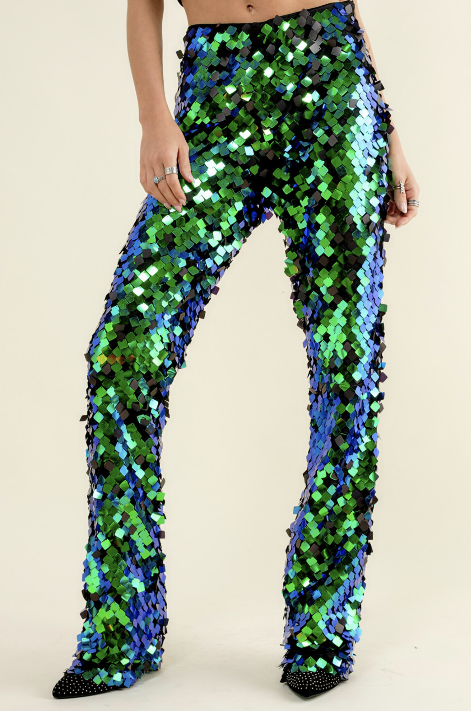 https://cdn.shoplightspeed.com/shops/621347/files/59722542/1500x4000x3/blue-b-iridescent-green-square-disc-sequin-pants.jpg