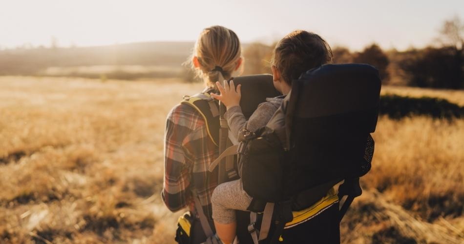 woman hiking with a baby