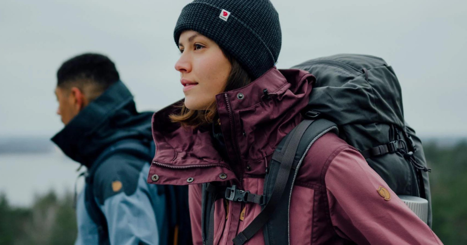 Woman hiking with a black backpack