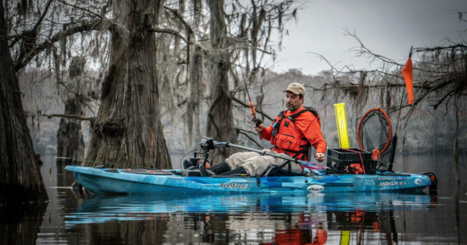 man fishing on a Feelfree Moken 12.5 v2 kayak