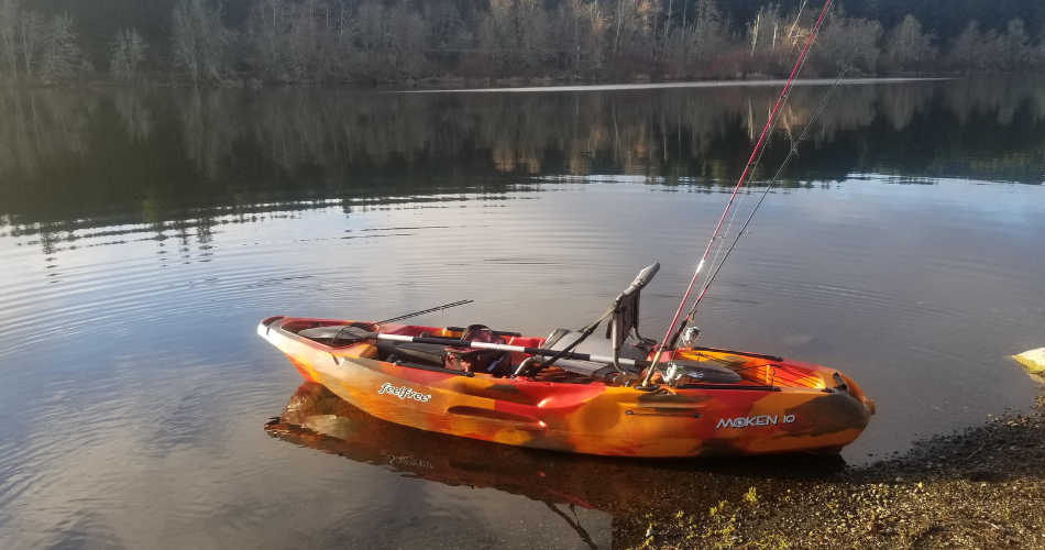 moken 10 kayak in water on a lake