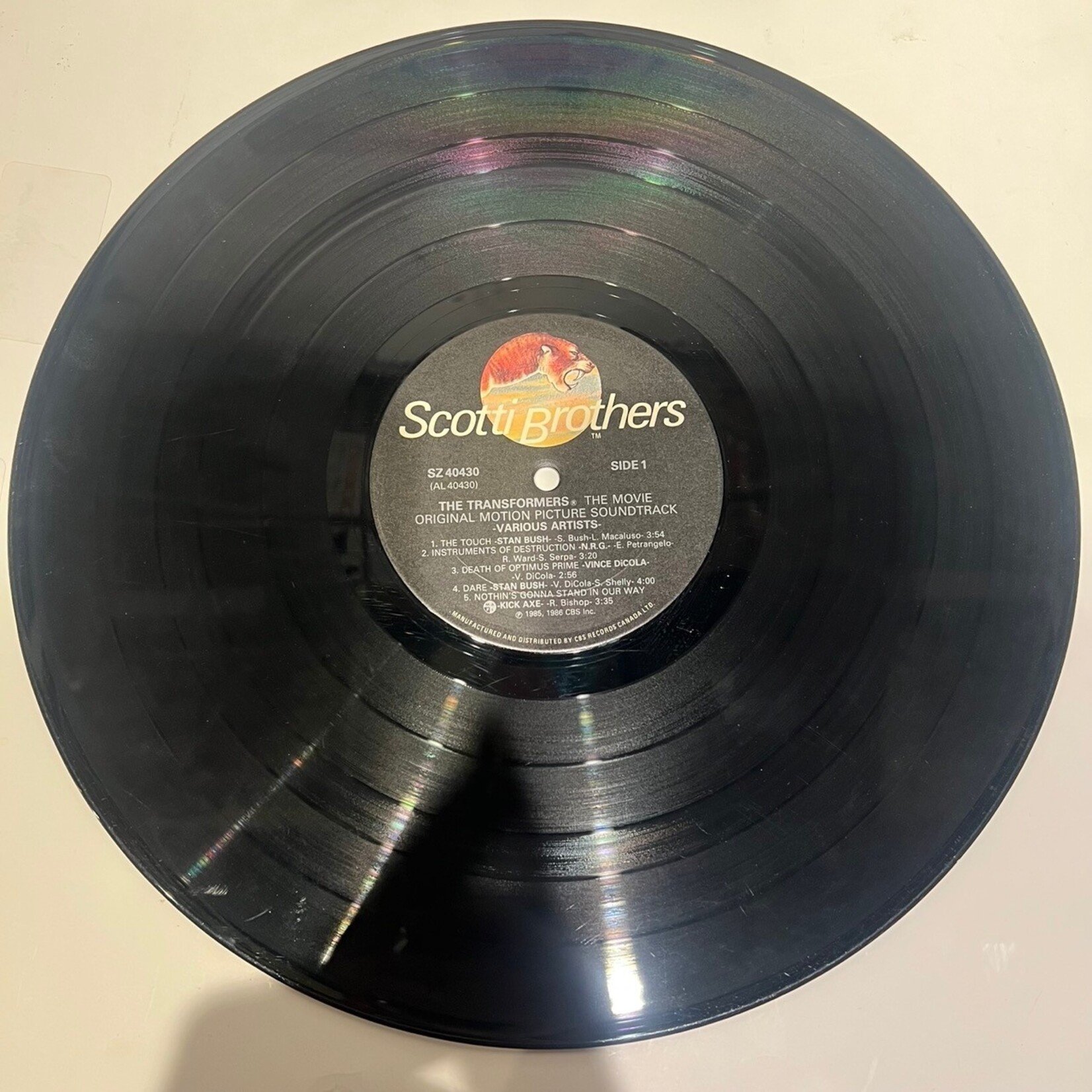 [Kollectible Vinyl] Various: Transformers - the Movie Original Motion Picture Soundtrack (1986, CANADA, Gold-Stamp, Promo, Soundtrack, VG)[SCOTTI BROTHERS]