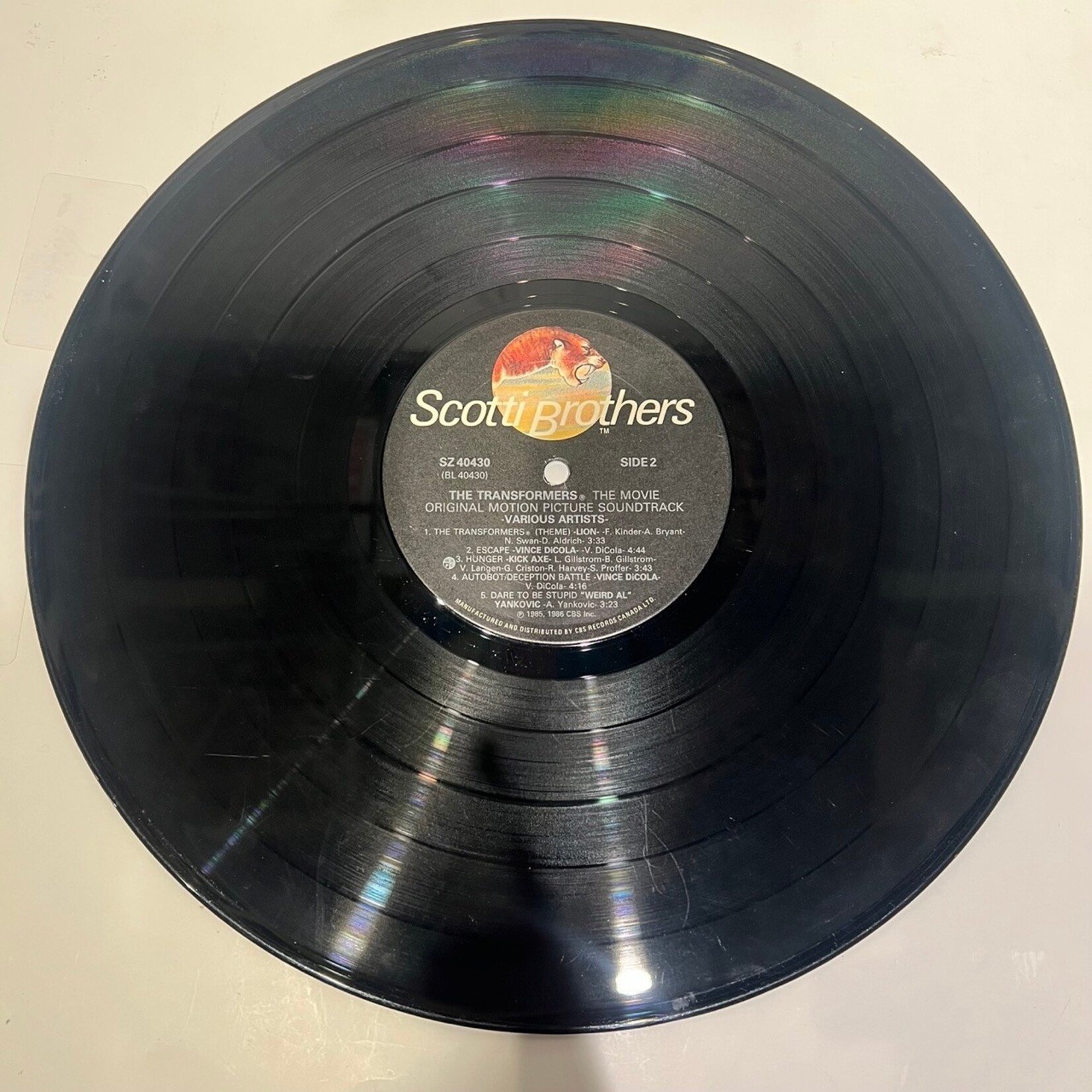 [Kollectible Vinyl] Various: Transformers - the Movie Original Motion Picture Soundtrack (1986, CANADA, Gold-Stamp, Promo, Soundtrack, VG)[SCOTTI BROTHERS]