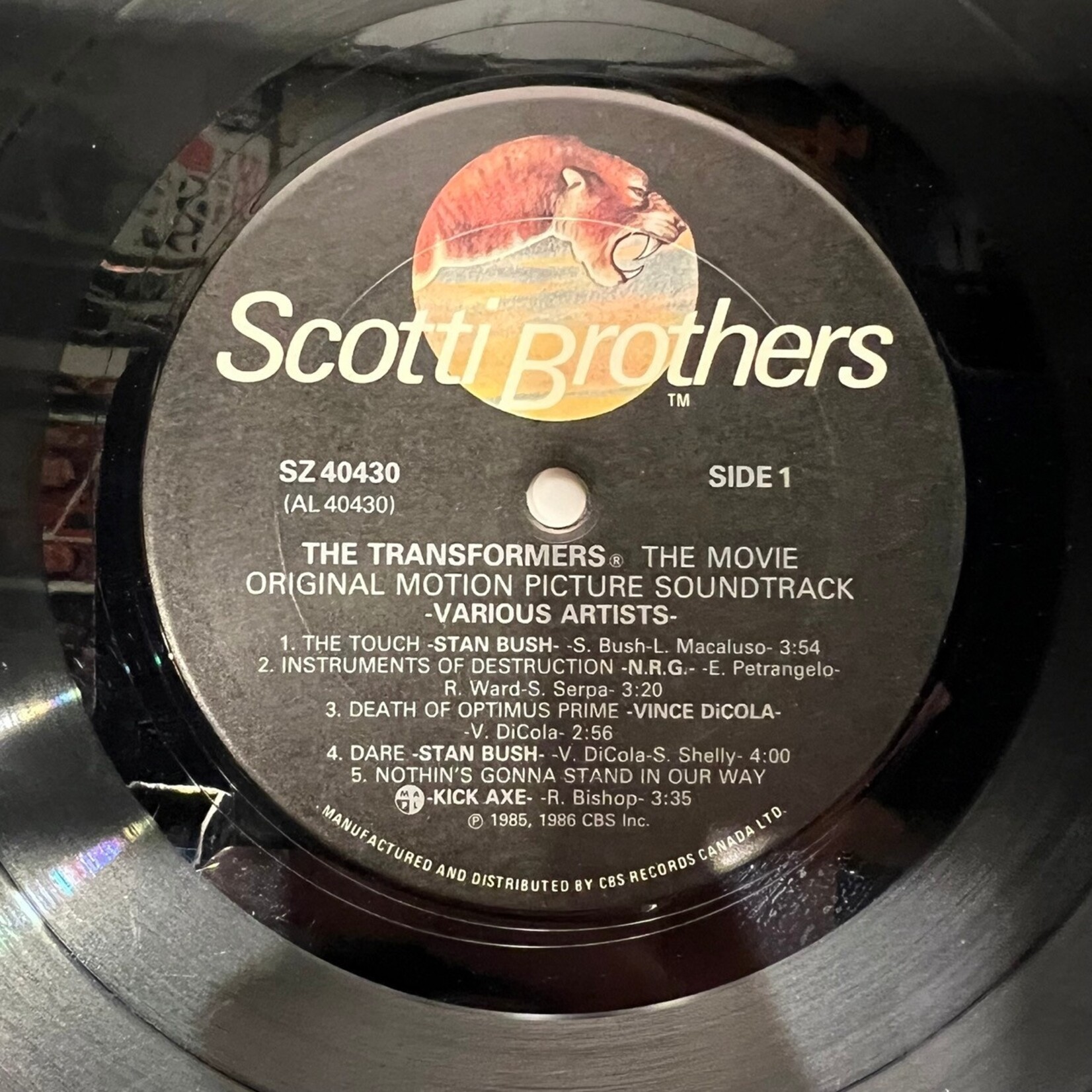 [Kollectible Vinyl] Various: Transformers - the Movie Original Motion Picture Soundtrack (1986, CANADA, Gold-Stamp, Promo, Soundtrack, VG)[SCOTTI BROTHERS]