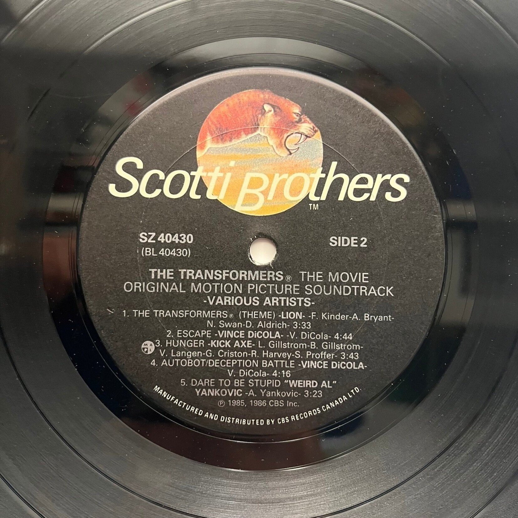 [Kollectible Vinyl] Various: Transformers - the Movie Original Motion Picture Soundtrack (1986, CANADA, Gold-Stamp, Promo, Soundtrack, VG)[SCOTTI BROTHERS]