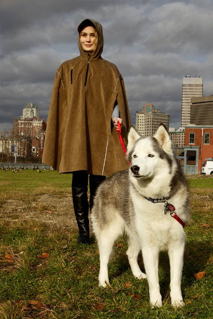 Dog walker wearing a rain cape