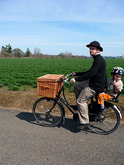 A WorkCycles cargo bike with a wicker front basket