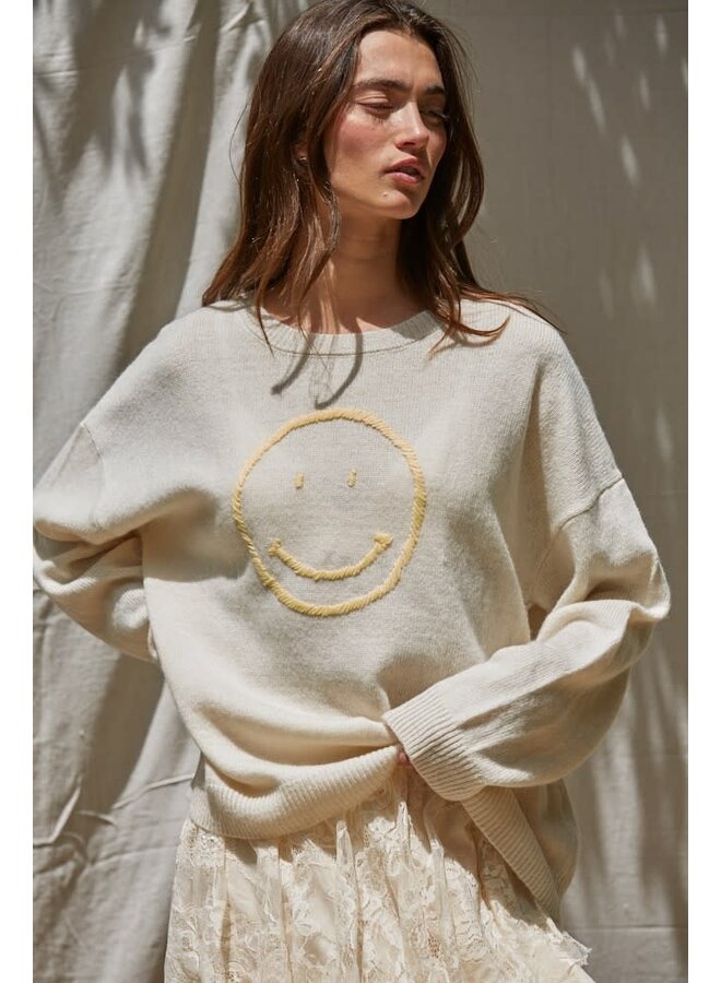 PLAYFUL SMILEY SWEATER