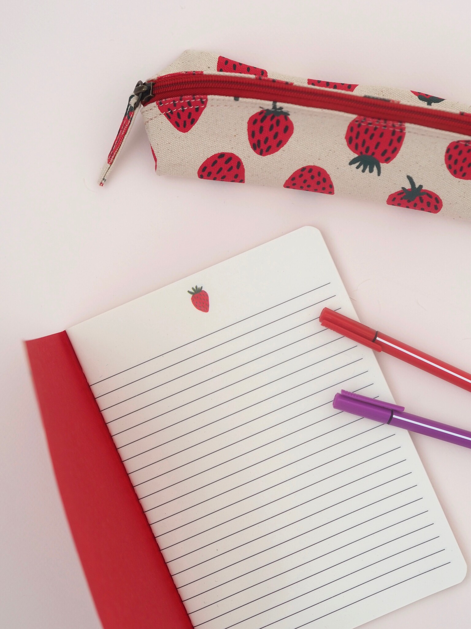 Strawberry notebook and pencil case