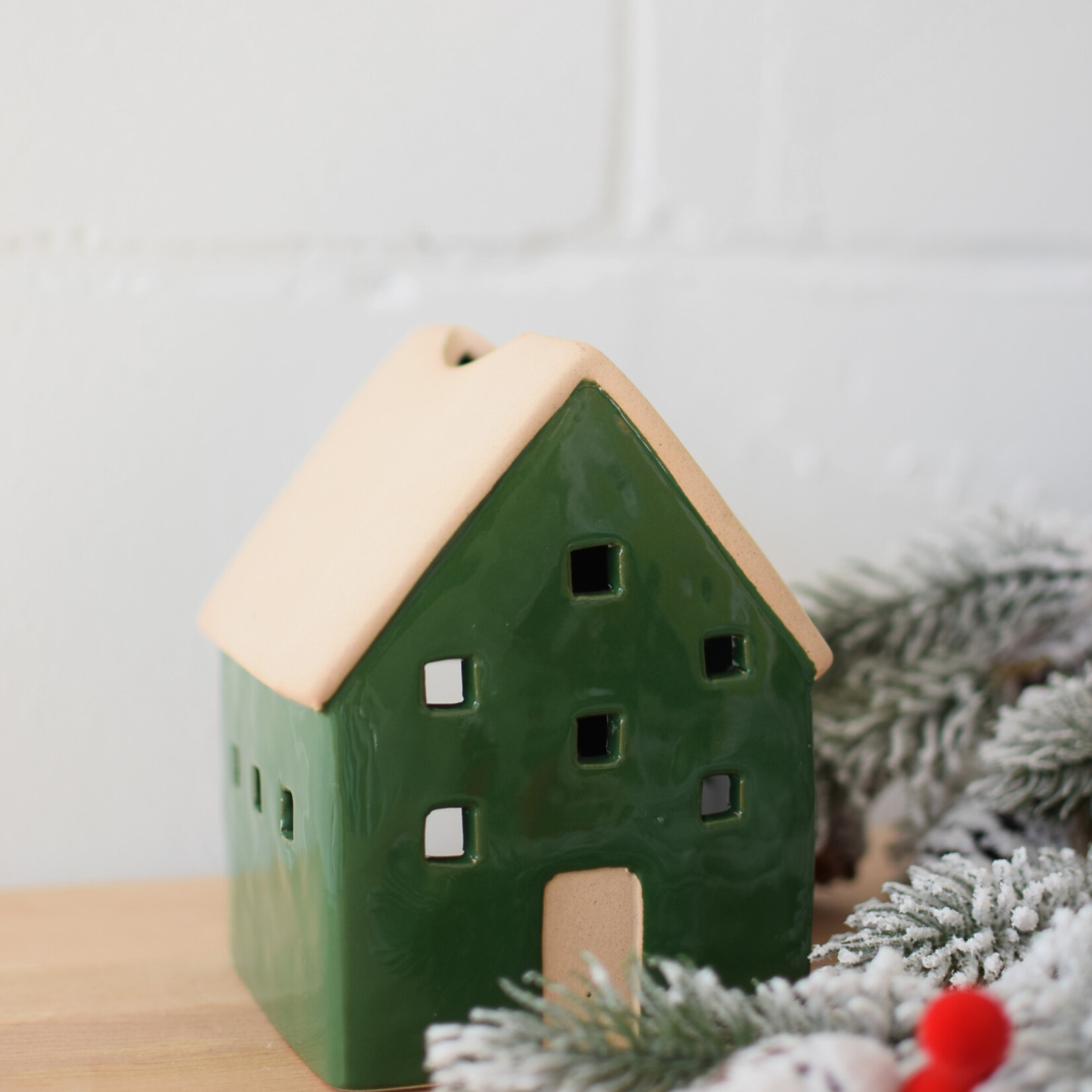 Green and beige house candle jar