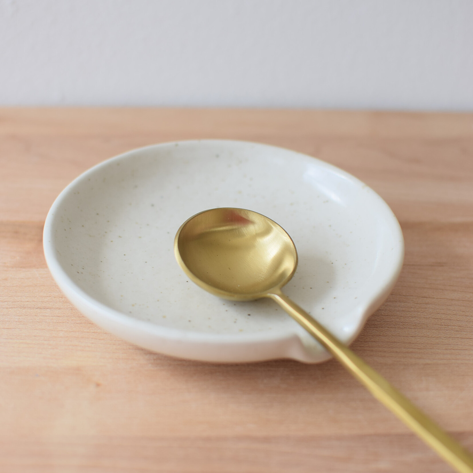 Long golden spoon