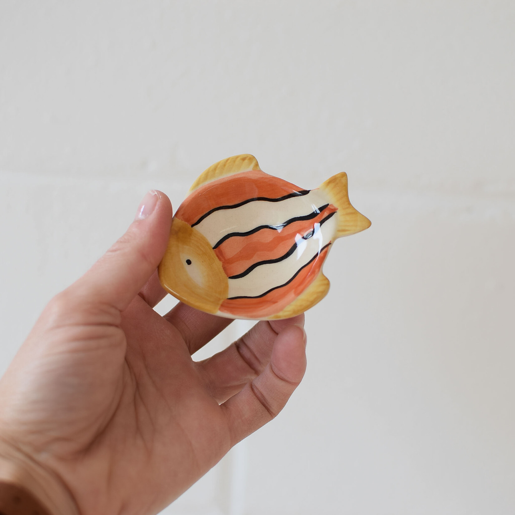 Small orange and white fish pinch