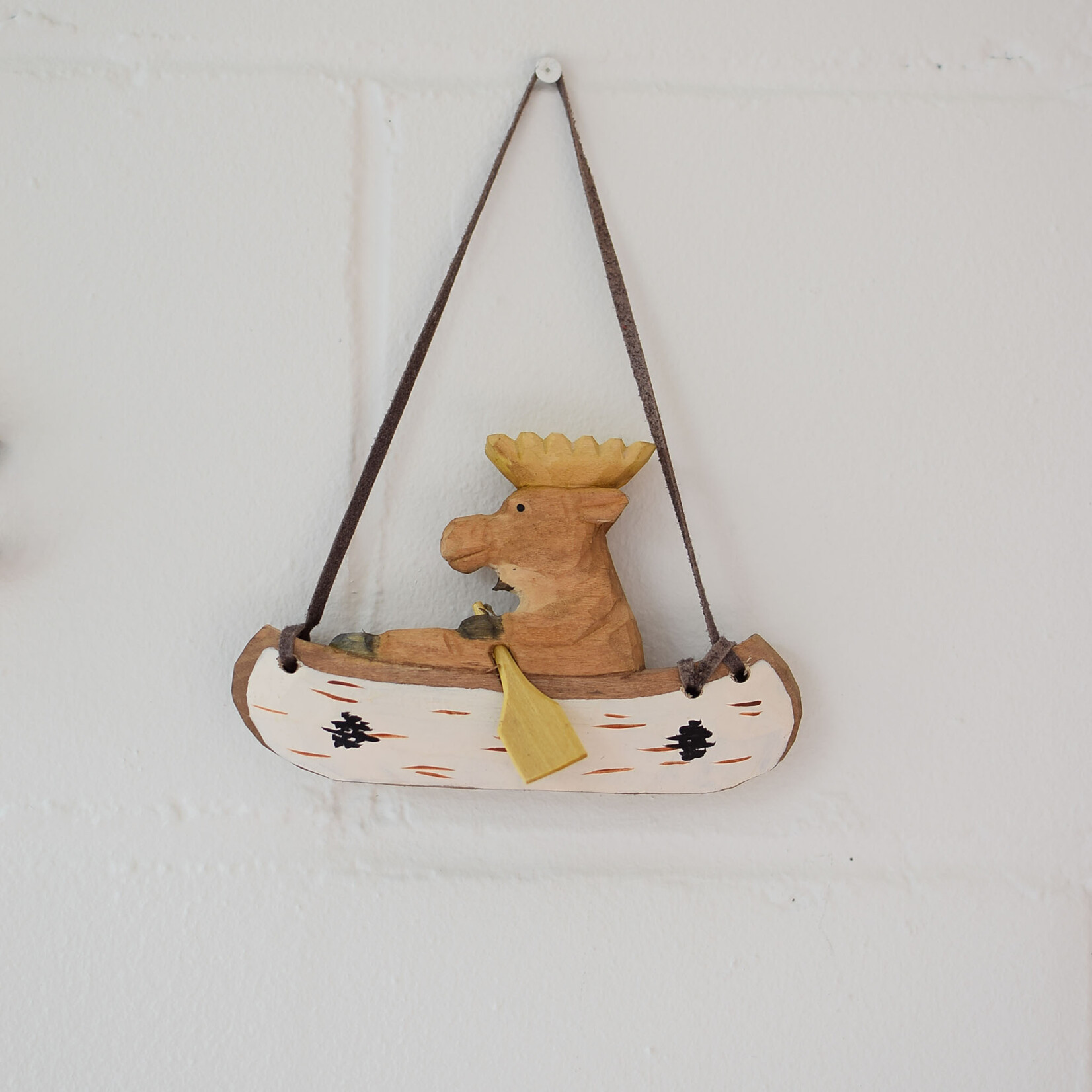 Carved ornament - Moose in a canoe