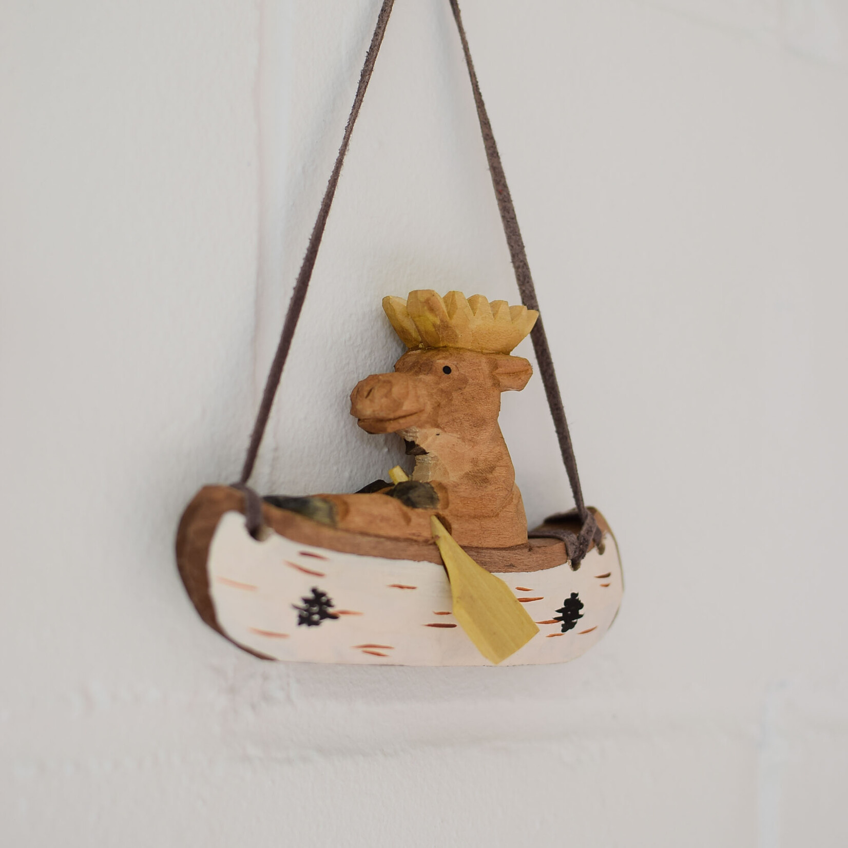 Carved ornament - Moose in a canoe