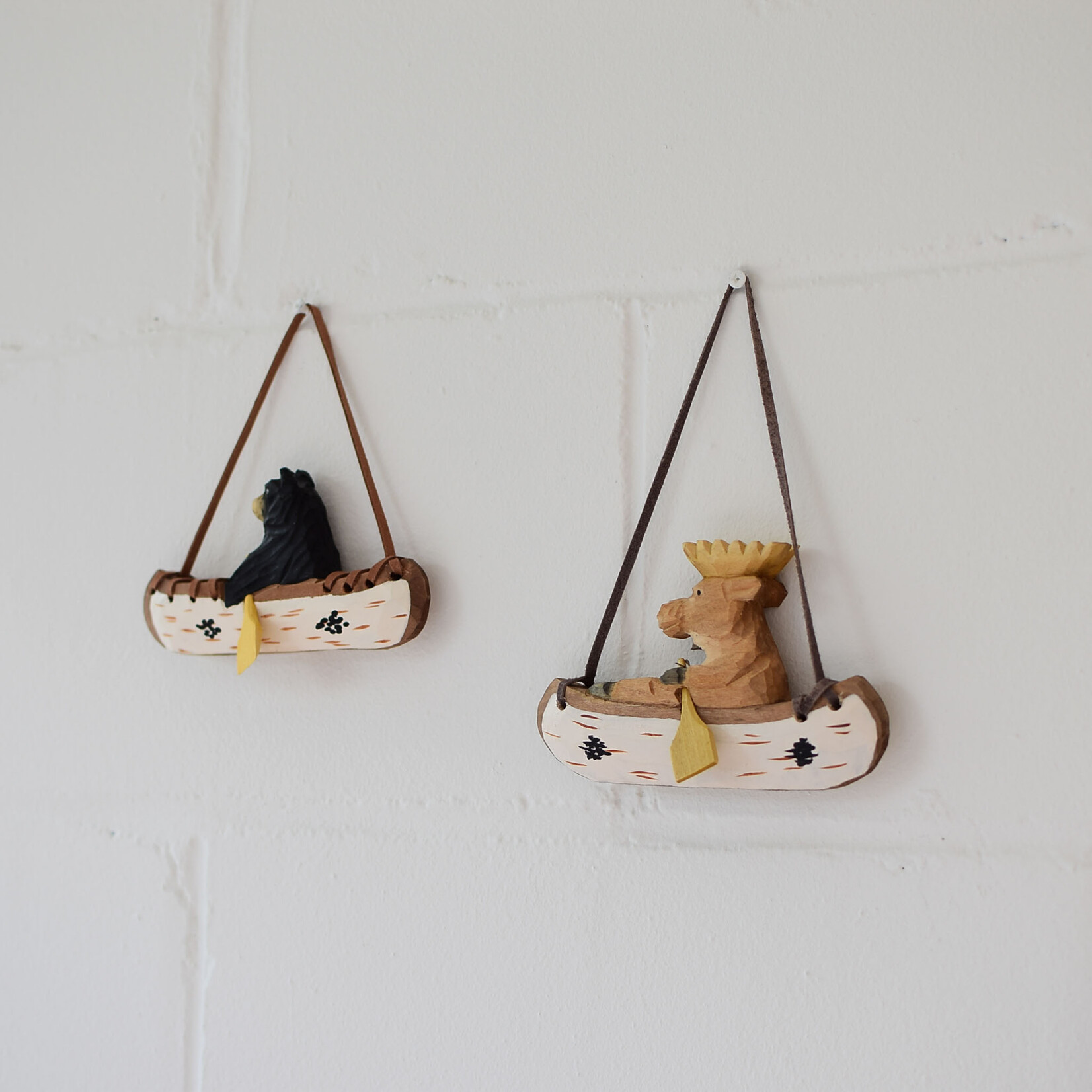 Carved ornament - Bear in a canoe